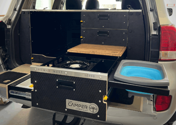 Side profile of Land Cruiser 200 drawer system featuring integrated fridge slider and cargo rails